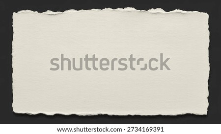 A rectangular piece of light beige or off-white paper with natural, rough, torn deckle edges, resting on a dark, plain background, showcasing its textured surface.