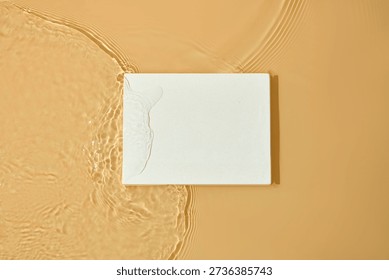Rectangular podium resting on textured warm surface with subtle water marks. Simple and structured background for product placement or graphic layouts