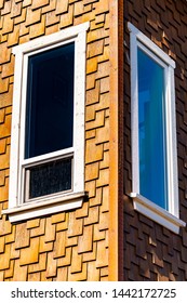 Rectangular Shaped Sliding Up Down And Fixed Corner Room Glass Windows On Modern Architecture Home/ Apartment/ Commercial Office Building. White Window Hung Sash Framework Holding Tinted Glass Panes.