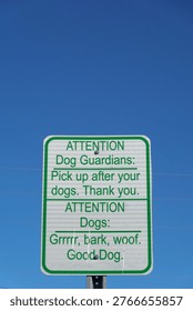 Rectangular sign with green text on a white background. It says, 