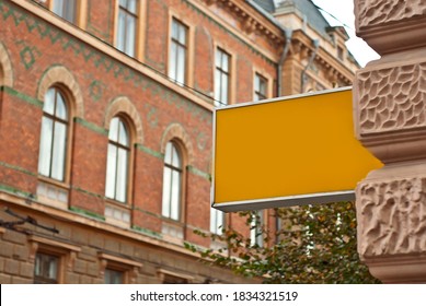 Rectangular sign on the building. Copy space and space for text. Mockup for design. Blank template for advertising.