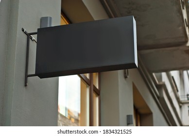 Rectangular sign on the building. Copy space and space for text. Mockup for design. Blank template for advertising.