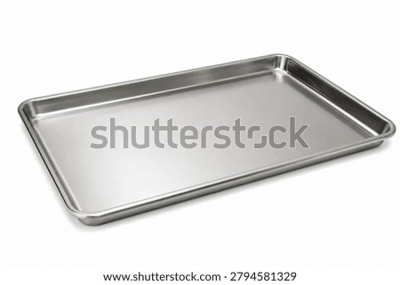 Rectangular stainless steel baking tray isolated on a clean white background. Featuring a durable metal construction with raised edges, this versatile kitchen pan is suitable for baking, roasting, cooling, and food preparation. Ideal for culinary, cookware, restaurant, and professional kitchen equipment concepts.