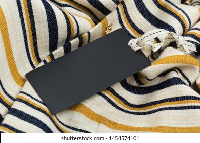 Rectangular Tag On A Clothes. Fashion, People And Shopping Concept - Close Up Price Tag Of Clothing Item