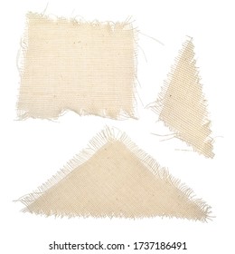 Rectangular and triangular ragged pieces of rag isolated on a white background. Dry waste, torn clothes. Background from fabric, canvas texture, threads on the edge of the drapery.