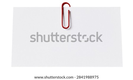 Rectangular white paper sheet attached with a single red metal paperclip