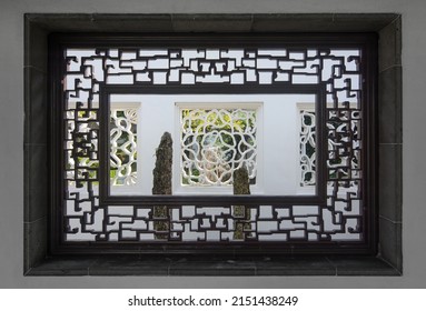 Rectangular Window And Ornate Wooden Frame In A Classical Chinese Garden