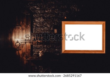 A rectangular wooden frame, serving as a mockup, is displayed on a dark stone wall. An old wooden door and a skull sit nearby, in a dimly lit escape room.