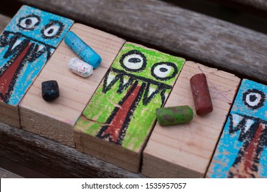 rectangular woods painted with a monster drawing for Halloween