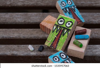 rectangular woods painted with a monster drawing for Halloween