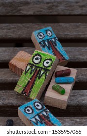 rectangular woods painted with a monster drawing for Halloween