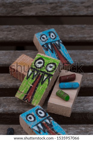 rectangular woods painted with a monster drawing for Halloween