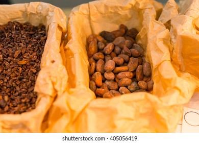 Rectangular Yellow Paper Wrapped Boxes Full Of Raw Cocoa Or Nuts For Sale On Counter At Cafe Or Store