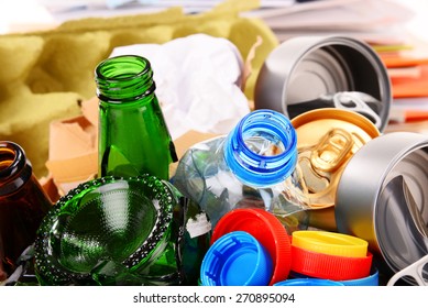 Recyclable garbage consisting of glass, plastic, metal and paper isolated on white background - Shutterstock ID 270895094