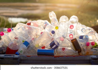 Recyclable garbage of glass and plastic bottles in rubbish bin