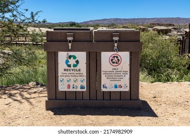 Recycle Bin Made Of Plastic Logs With Recycle Logos On It. Plastic, Glass, Metal Cans And Food Waste Can Be Recycled In This Bin, Depending On Which Side You Put Your Waste Products.