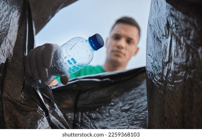 Recycle, bottle and man with view in bag, sustainability and cleaning plastic pollution for earth day and help with community. Saving the environment, charity and people putting trash in garbage bin. - Powered by Shutterstock