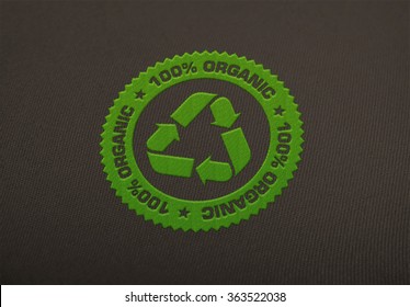 Recycle Logo Embroidered On Cloth Background.