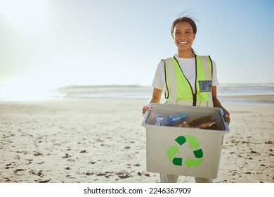 Recycle, plastic and woman cleaning beach for sustainability, green environment and eco friendly world with happy volunteering portrait. Box, bottle and black woman at sea for pollution or earth day - Powered by Shutterstock