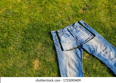 Recycle, reuse, repurpose, upcycle, upgrade concept. New life to old things, make your own clothes from boyfriend jeans - Shutterstock ID 1725090409