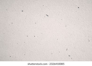 Recycled artisan paper mottled with natural fibres, luxury eco paper background 