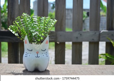 Recycled Colored Flower Pot Made Of A Used Plastic Bottle. Nice For Indoor And Outdoor.