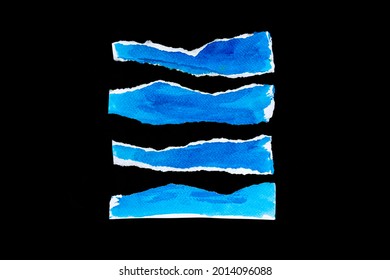 Recycled paper craft stick black background  Blue paint paper torn ripped pieces close up blue paper isolated black background and clipping path 
