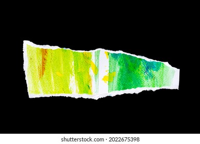 Recycled paper craft stick on a black background, Blue adn orange and yelow and green paint paper torn or ripped pieces of close up blue paper isolated on black background with clipping path.