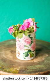 Recycled Tin Can Planter Whith Pink Flowers.