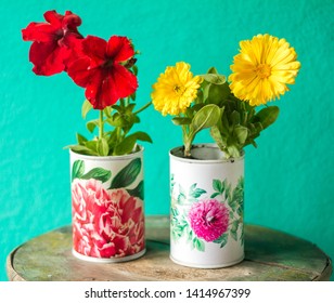 Recycled Tin Cans Planters Whith Red And Yellow Flowers