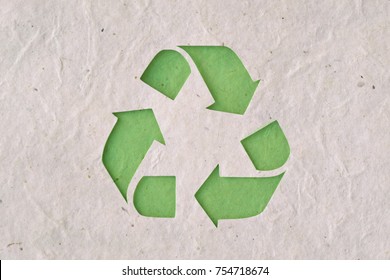 Recyclig symbol on recycled paper - Shutterstock ID 754718674