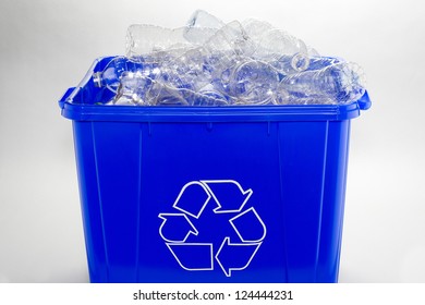 A Recycling Bin Filled With Plastic Bottles