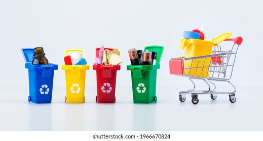 Recycling Bin With Plastic Trash In Small Shopping Cart And Containers With Garbage Of  Different Types On Grey Background. Banner.