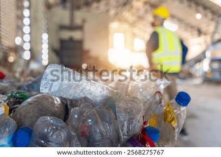 A recycling center, emphasizing the organized process of transforming waste into valuable resources, Focus on plastic waste.