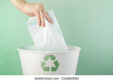 Recycling, Environmental Protection, The Hand Throws The Pet Diaper Into The Bin, Waste Sorting