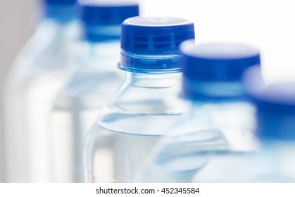 Recycling, Healthy Eating, Industry, Packing And Food Storage Concept - Close Up Of Plastic Bottles With Pure Drinking Water