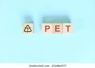 Recycling Icon Number 1 For PET Or Polyethylene Terephthalate Symbol On Wooden Blocks Flat Lay.