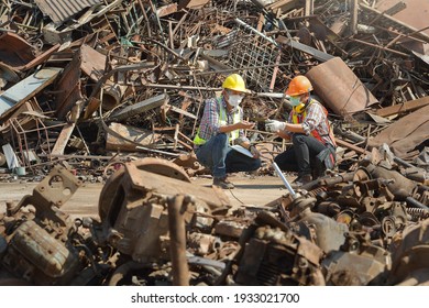 Recycling industry a worker who recycling thing on recycle center.Manager and Manual Worker in Metal Landfill - Shutterstock ID 1933021700