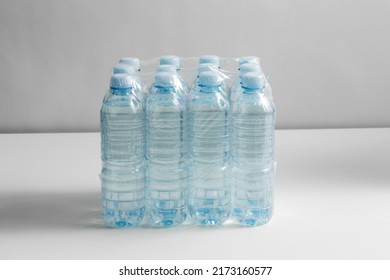 Recycling, Packing And Storage Concept - Close Up Of Plastic Bottles With Pure Drinking Water On Table