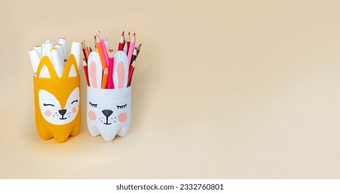 Recycling plastic bottles. Crafts ideas for the children's room. Handmade container for pencils in the form of bunny and fox - Powered by Shutterstock