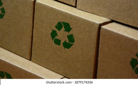 Recycling stamp printed on cardboard box. Recycle symbol, arrows, recyclable materials, environmental protection and earth safe concept. - Shutterstock ID 1879174336