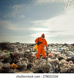 Recycling Worker Measuring Pollution On The Landfill