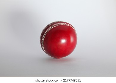 
Red 6 Stitched Cricket Ball In Light Box.