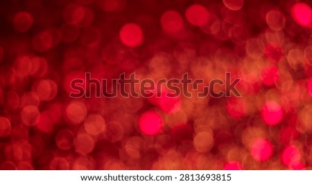 Red abstract bokeh background with soft defocused light circles