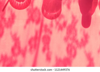 Red abstract light pattern on a wall