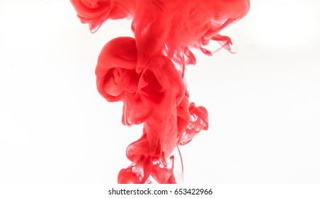 Red acrylic paint in water.