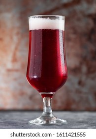 Red Ale Beer In A Glass On A Rusty Metal Background