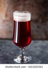 Red Ale Beer In A Glass On A Rusty Metal Background