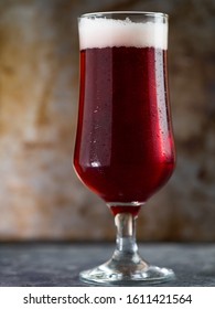 Red Ale Beer In A Glass On A Rusty Metal Background