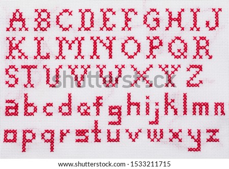 Red Alphabet Cross Stitch Sampler with Upper Case and Lower Case Letters.